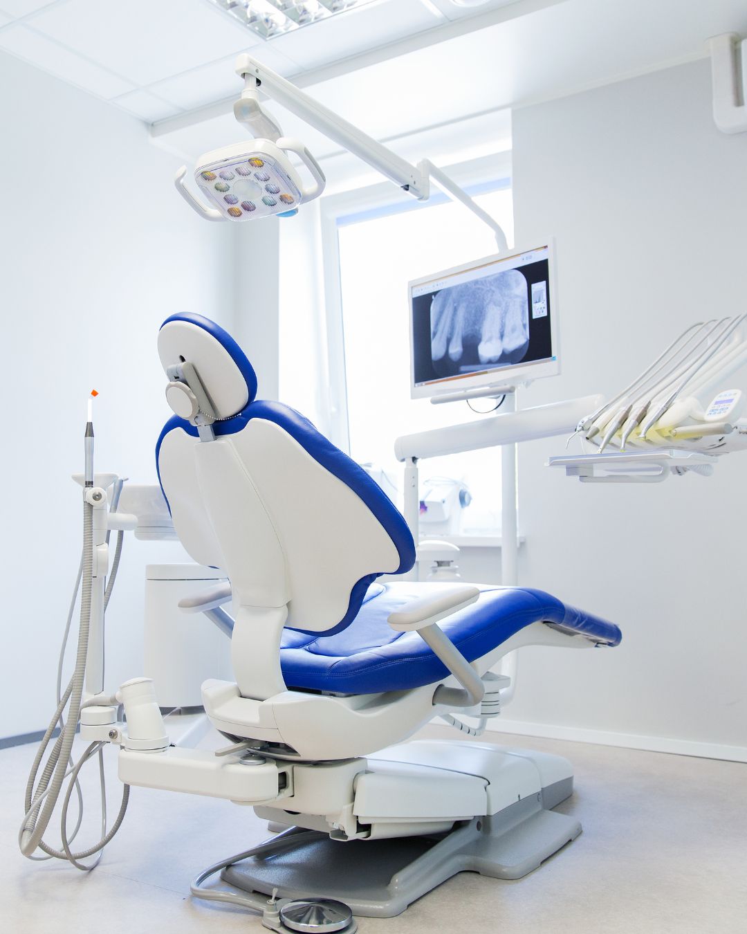 Dentist performing a dental procedure in a modern clinic